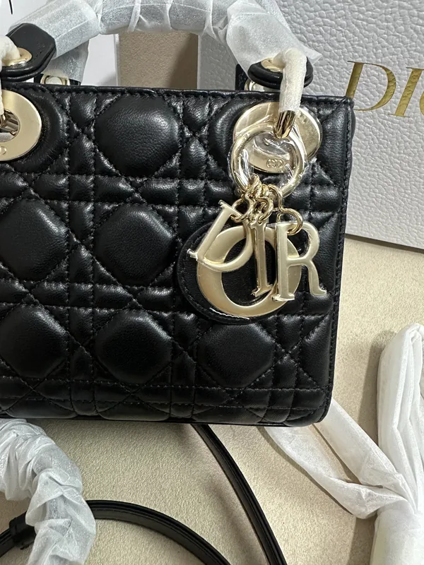 QC photo 2 · Cannage stitching + gold CD charm chain close-up on a Dior Lady rep bag. Matelassé pattern alignment shot