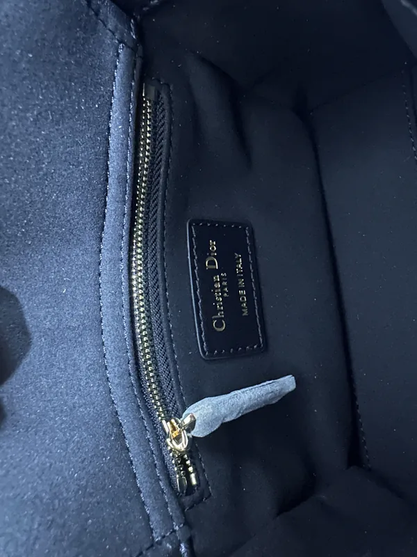 QC photo 3 · Interior lining shot showing Christian Dior Paris Made in Italy leather label and gold zipper on Dior Lady rep bag